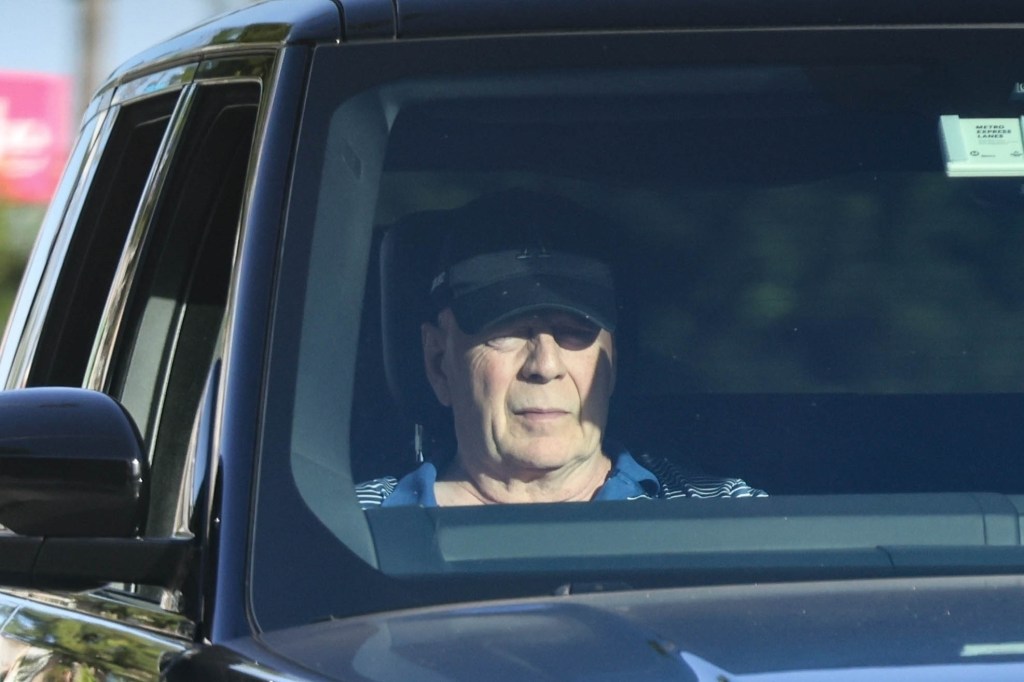 ‘Stable’ Bruce Willis, 69, seen riding in passenger side of car amid aphasia and dementia battles